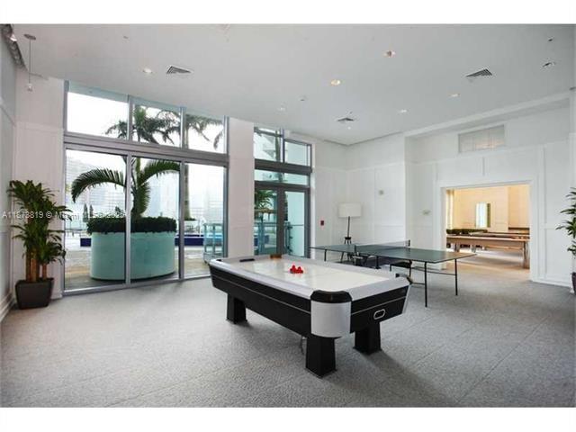 90 Southwest 3rd Street, Unit 1809 Miami, FL 33130 - Photo 18 of 35 a room with furniture and pool table