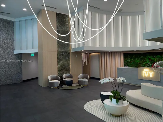 a bathroom with a double vanity sink a toilet and shower