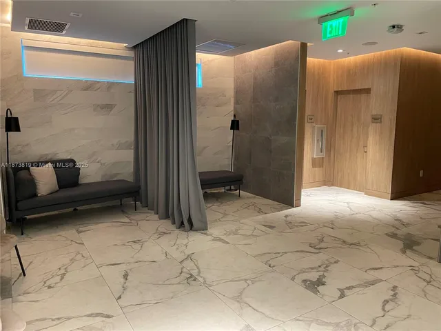 a bedroom with a bed and a cabinets