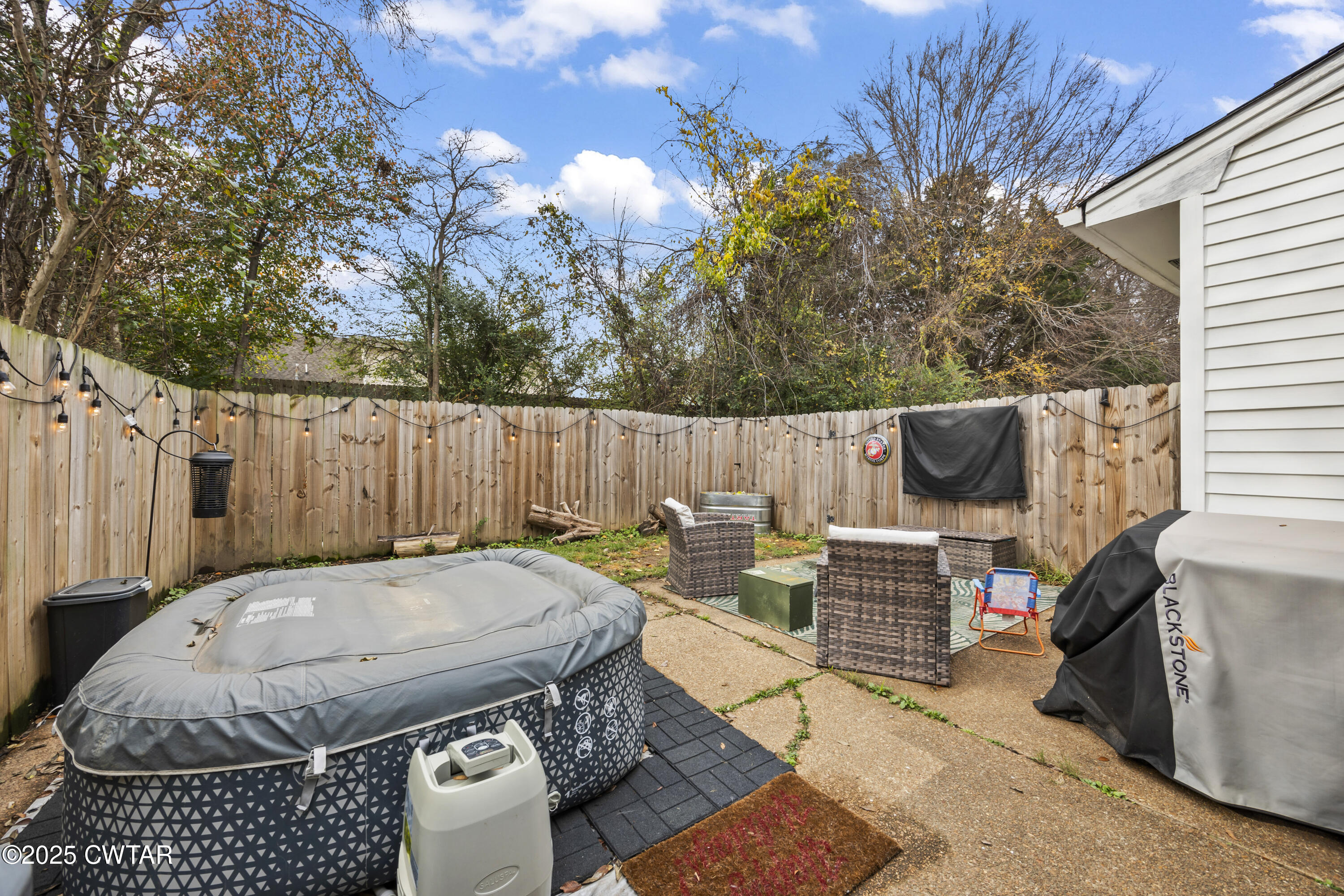 645 Walker Road Jackson, TN 38305 - Photo 16 of 16 a backyard of a house with table and chairs