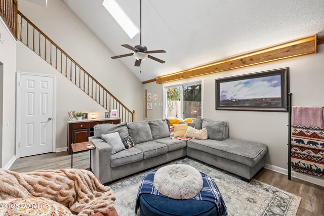 a living room with furniture and a rug