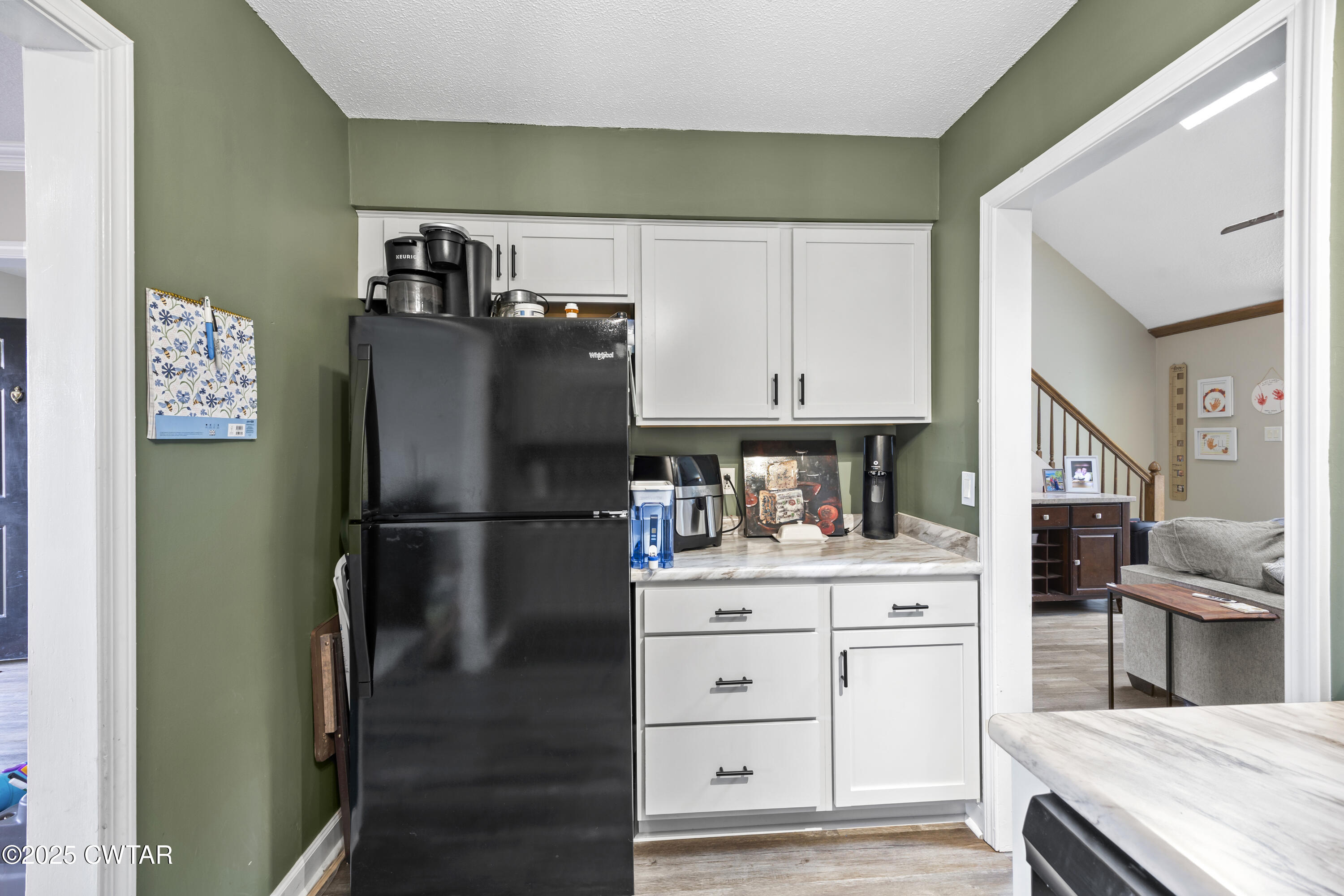 645 Walker Road Jackson, TN 38305 - Photo 7 of 16 a kitchen with stainless steel appliances a refrigerator and cabinets