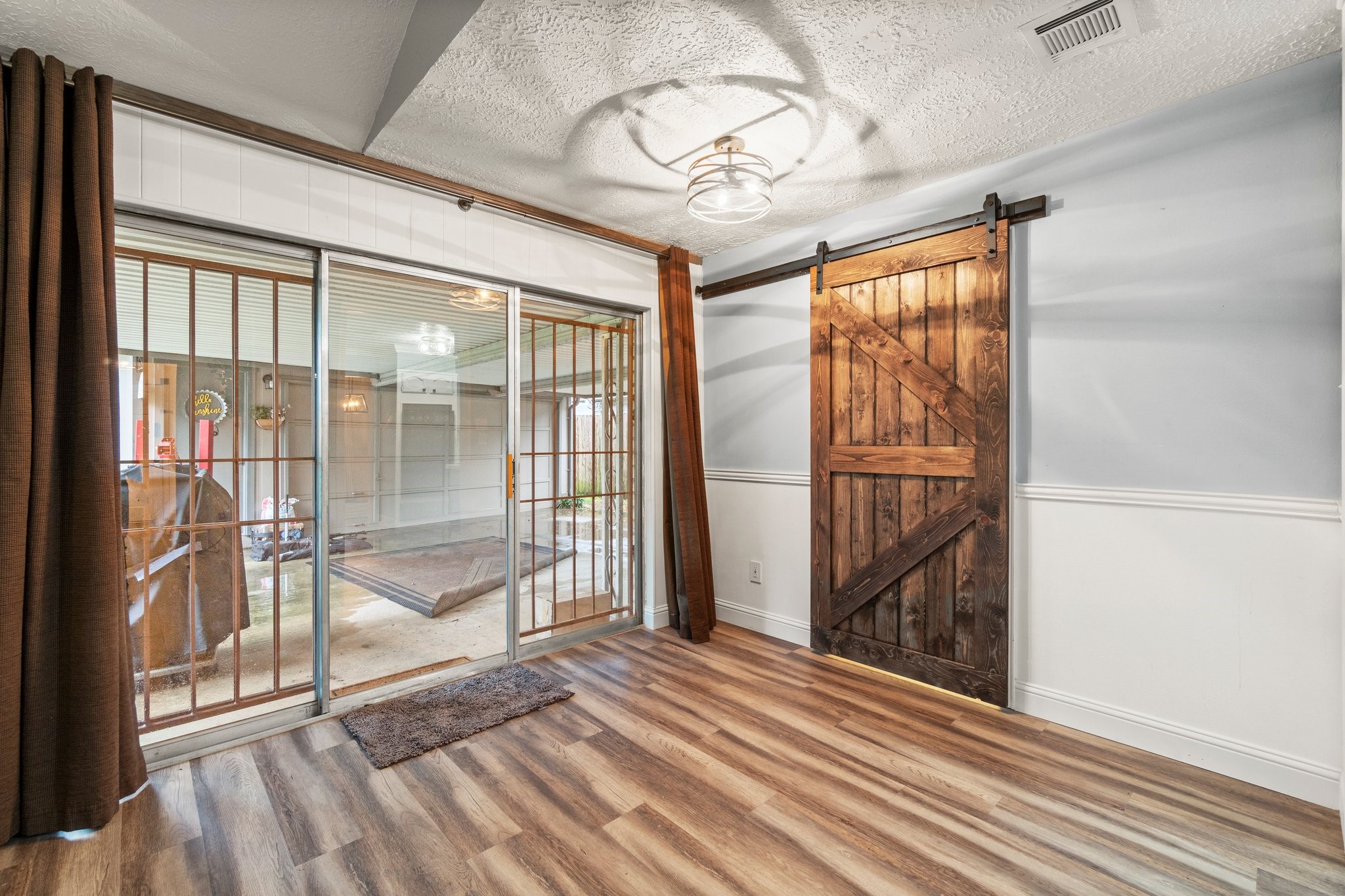 17610 Crestline Road Humble, TX 77396 - Photo 13 of 36 a view of a room with wooden floor and balcony