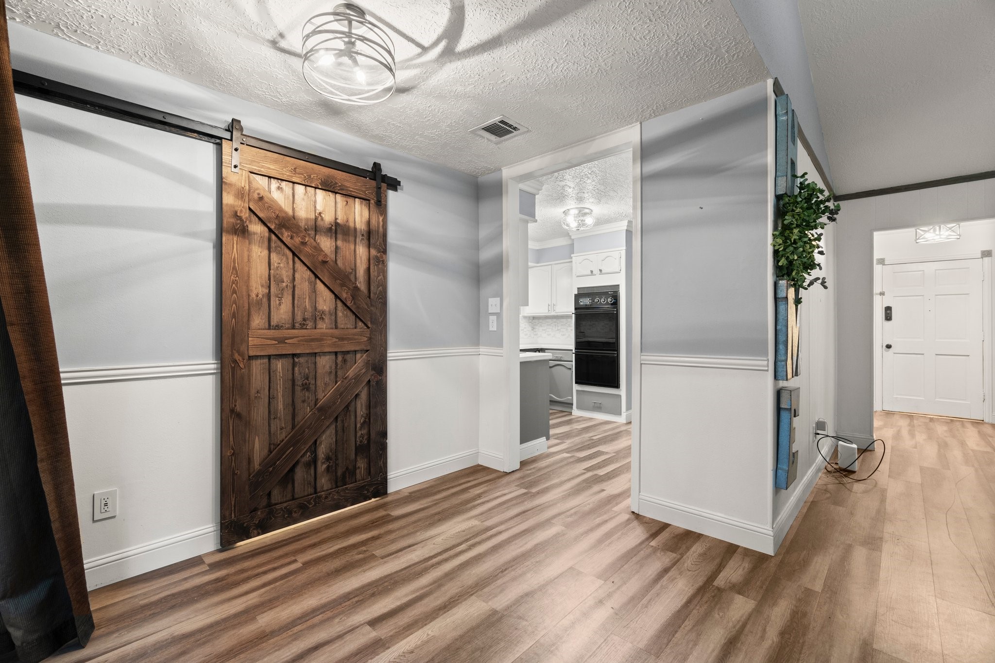17610 Crestline Road Humble, TX 77396 - Photo 14 of 36 a view of a hallway with wooden floor and staircase