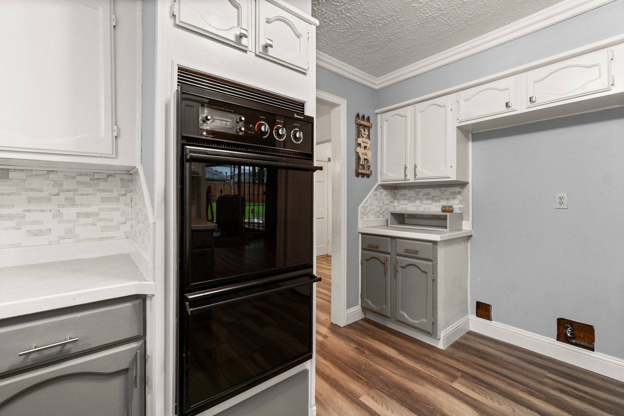 17610 Crestline Road Humble, TX 77396 - Photo 18 of 36 a kitchen with cabinets and stainless steel appliances