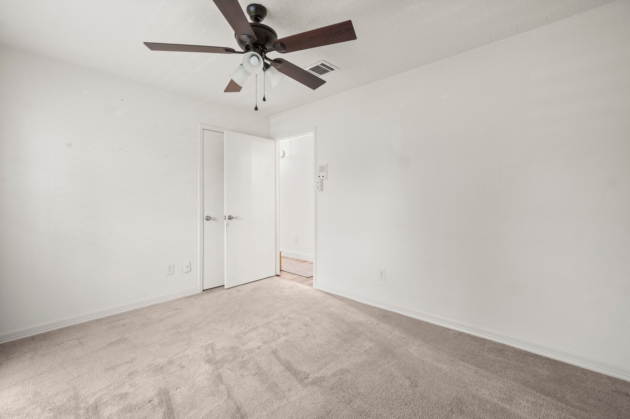 17610 Crestline Road Humble, TX 77396 - Photo 20 of 36 en empty room with ceiling fan
