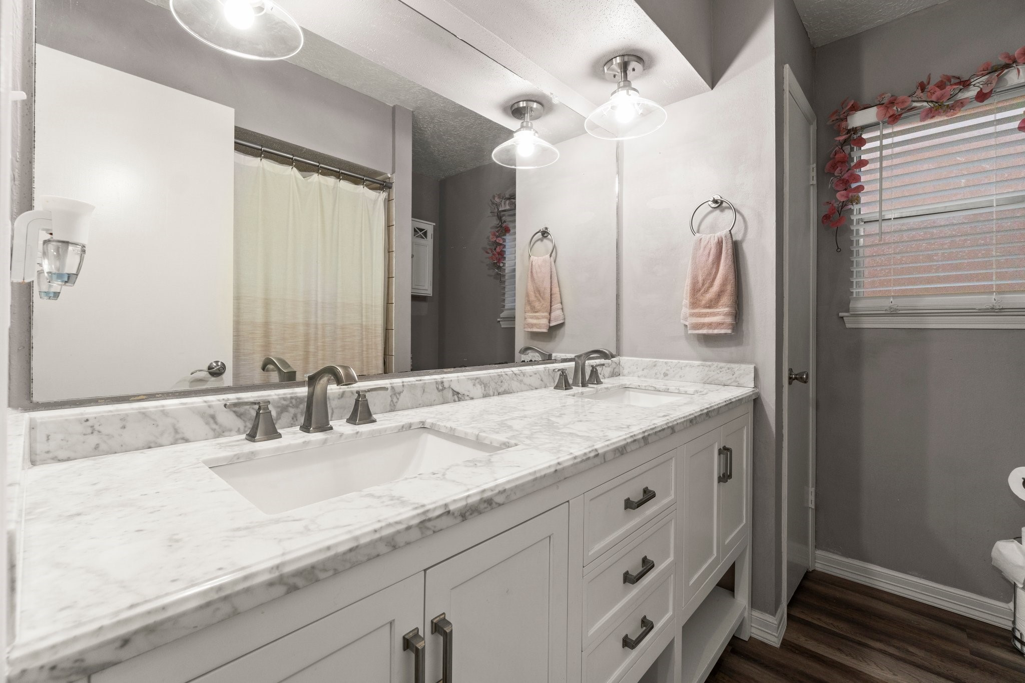 17610 Crestline Road Humble, TX 77396 - Photo 28 of 36 a bathroom with a granite countertop sink and a mirror