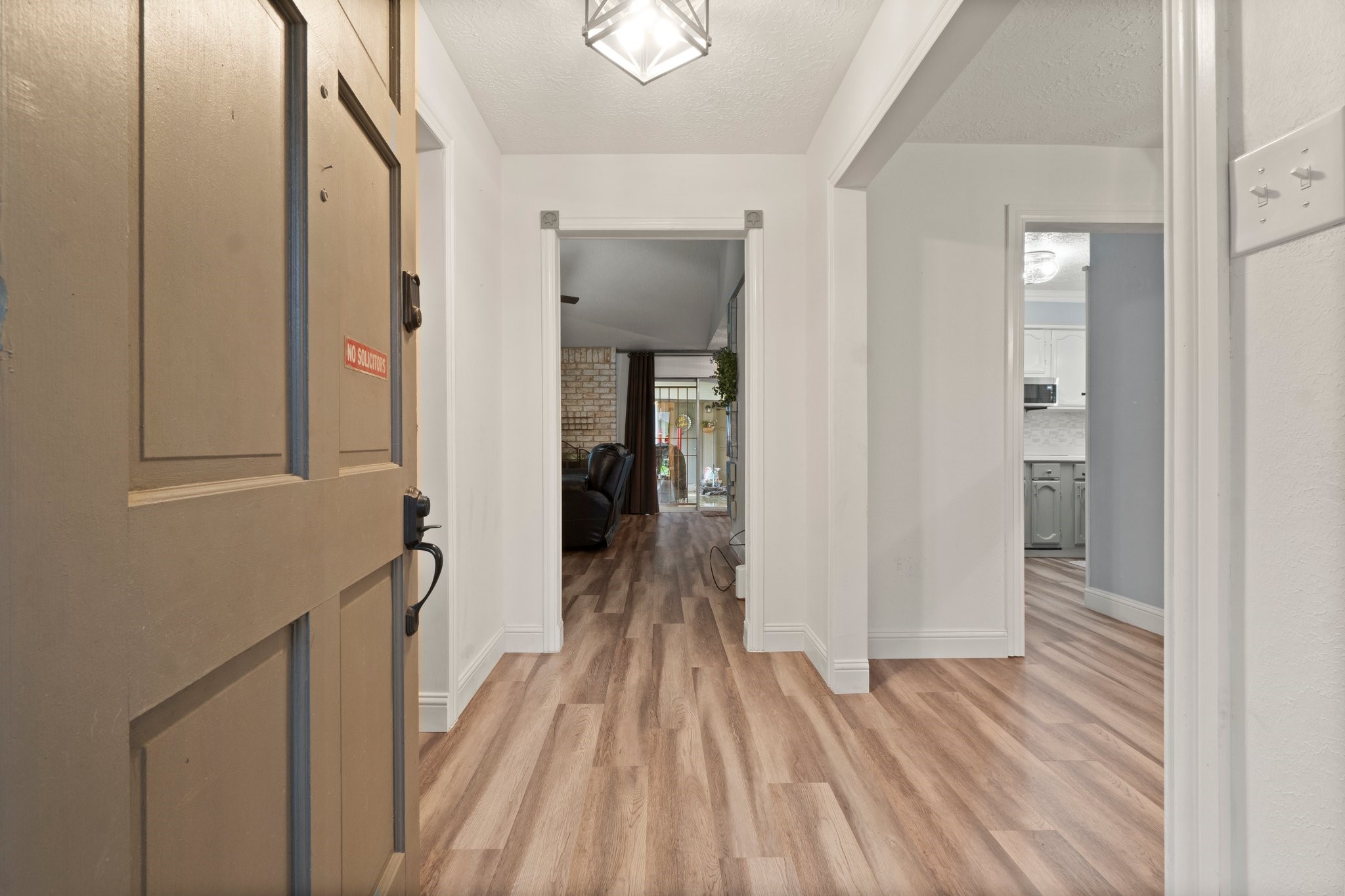17610 Crestline Road Humble, TX 77396 - Photo 5 of 36 a view of a hallway with wooden floor and staircase