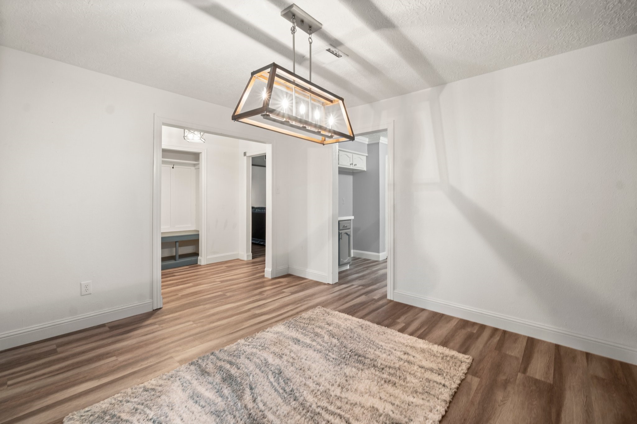17610 Crestline Road Humble, TX 77396 - Photo 8 of 36 a view of a hallway with wooden floor and staircase