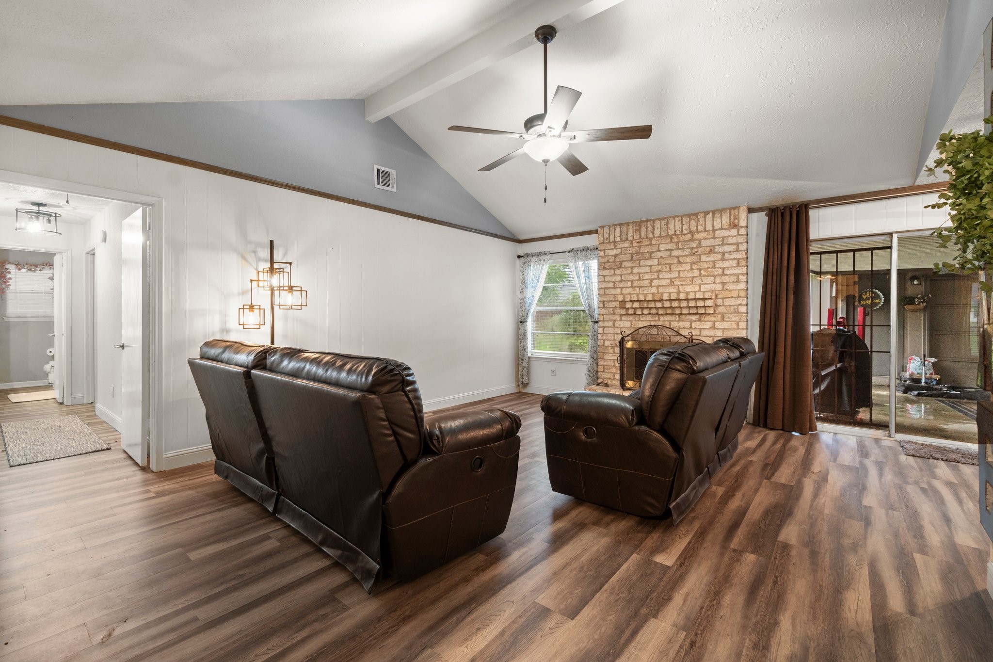 17610 Crestline Road Humble, TX 77396 - Photo 9 of 36 a living room with furniture and a chandelier