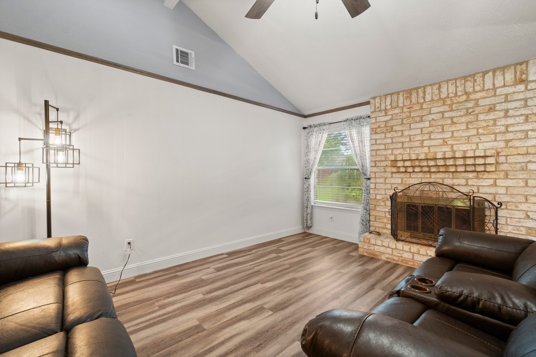 17610 Crestline Road Humble, TX 77396 - Photo 10 of 36 a living room with furniture and a fireplace