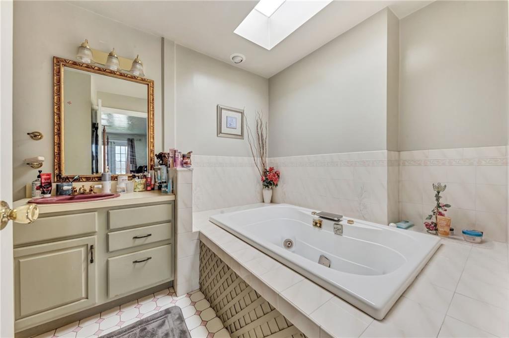 1017 McCoy Road McKees Rocks, PA 15136 - Photo 23 of 33 a bathroom with a sink and a mirror