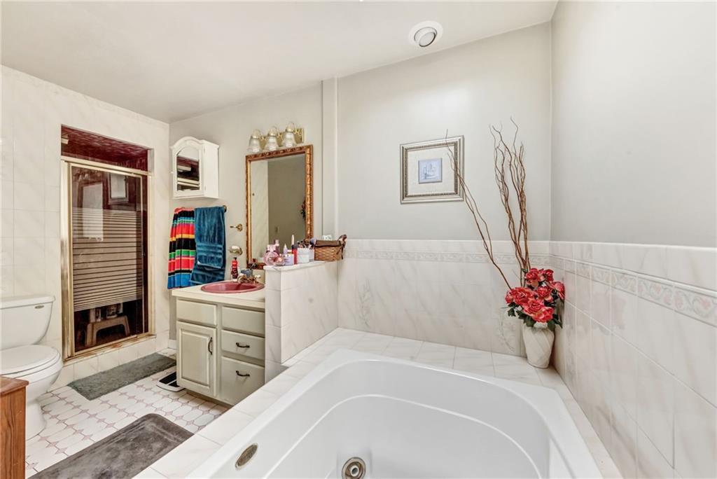 1017 McCoy Road McKees Rocks, PA 15136 - Photo 24 of 33 a bathroom with a tub sink and mirror