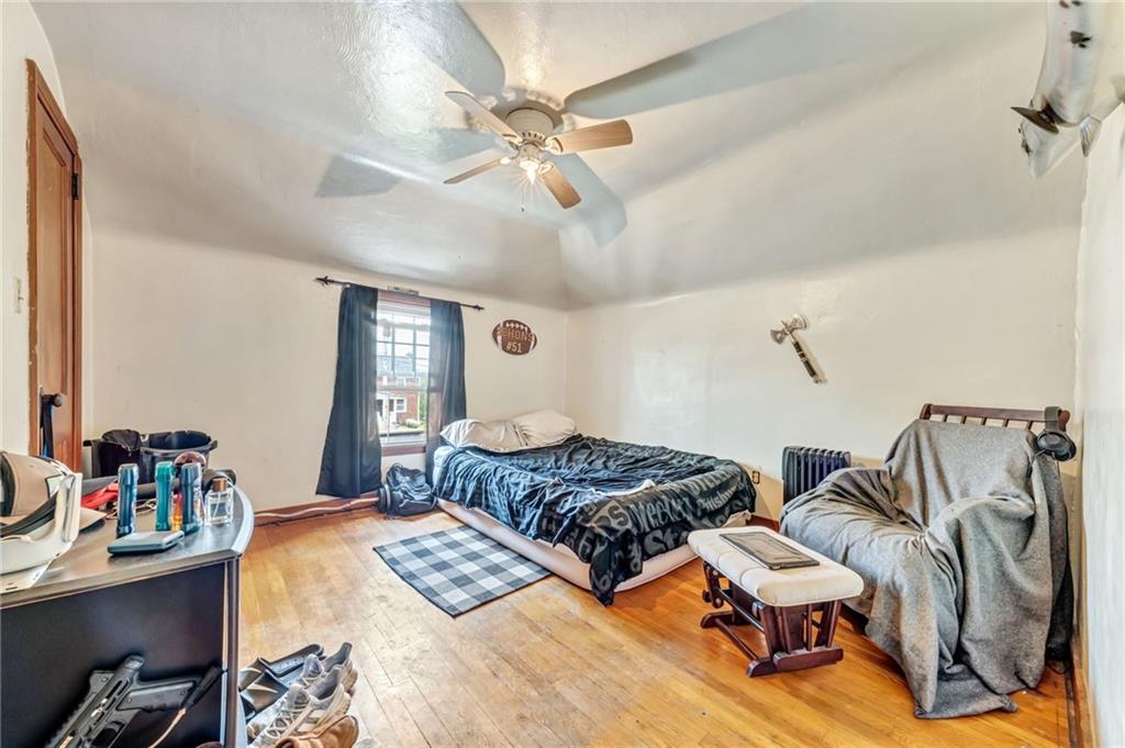 1017 McCoy Road McKees Rocks, PA 15136 - Photo 26 of 33 a bedroom with two beds and painting on the wall