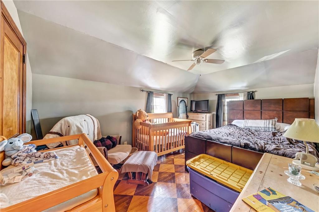 1017 McCoy Road McKees Rocks, PA 15136 - Photo 29 of 33 a living room with furniture fireplace and a window