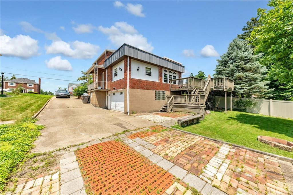 1017 McCoy Road McKees Rocks, PA 15136 - Photo 4 of 33 a front view of a house with a yard