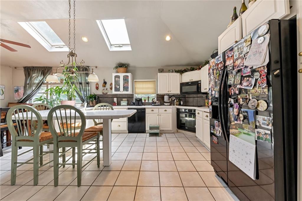 1017 McCoy Road McKees Rocks, PA 15136 - Photo 7 of 33 a kitchen with stainless steel appliances kitchen island granite countertop a stove a sink and a refrigerator