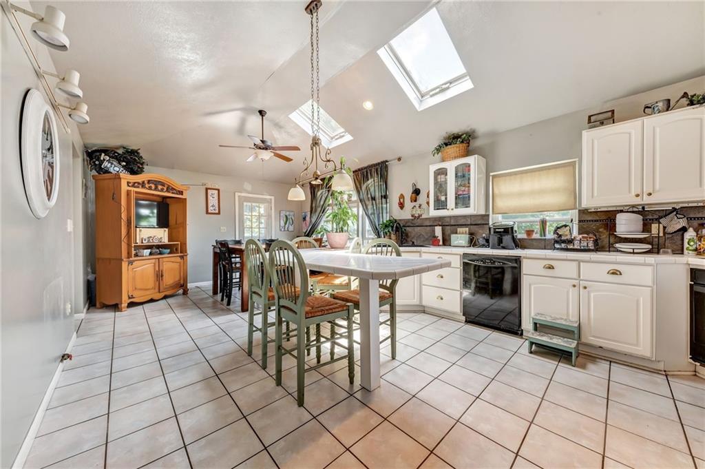 1017 McCoy Road McKees Rocks, PA 15136 - Photo 8 of 33 a kitchen with stainless steel appliances kitchen island granite countertop a sink a stove a table and chairs