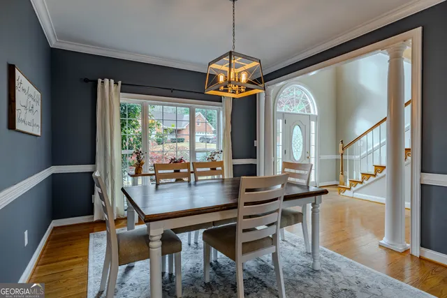 a view of a dining room with furniture window and outside view