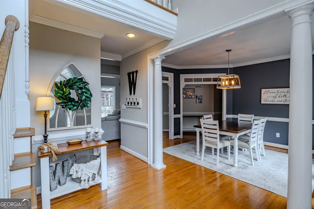 a living room with fireplace furniture and a rug