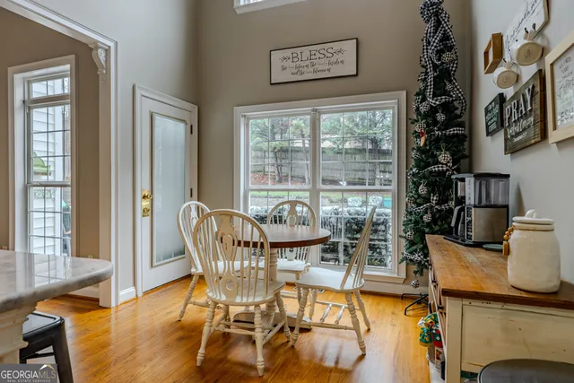 a kitchen with stainless steel appliances a sink a stove a refrigerator cabinets and a counter top space