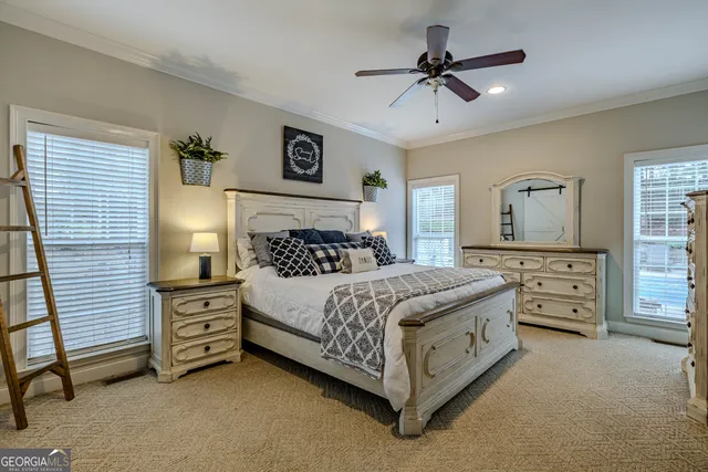 a bathroom with a white tub shower and sink