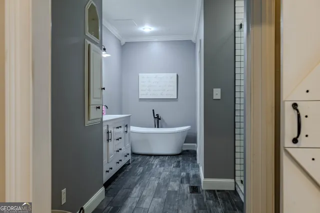 a living room with furniture and a book shelf