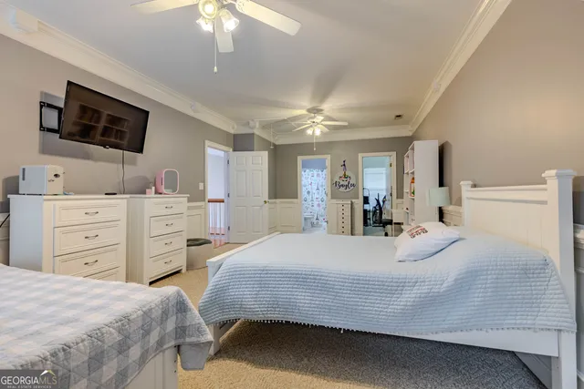 a room with furniture and a flat screen tv