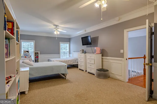 a bedroom with a bed and a painting