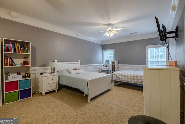 a bedroom with a bed and furniture