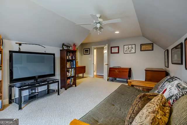 a view of a house with swimming pool and sitting area