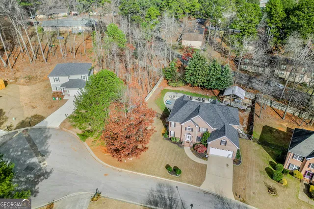 an aerial view of residential houses with outdoor space