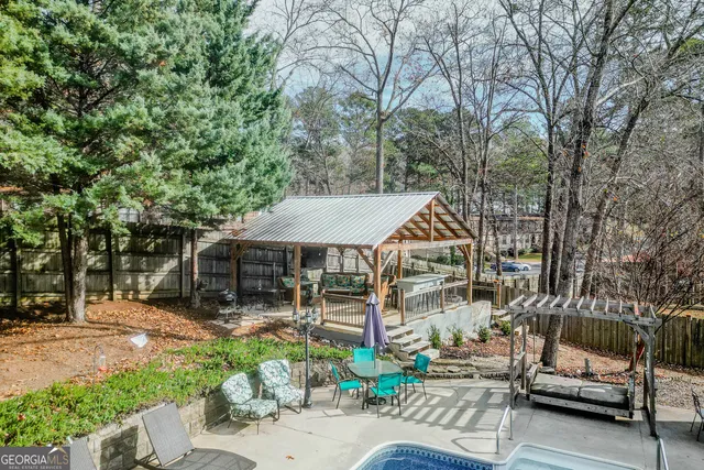 an aerial view of residential houses with outdoor space