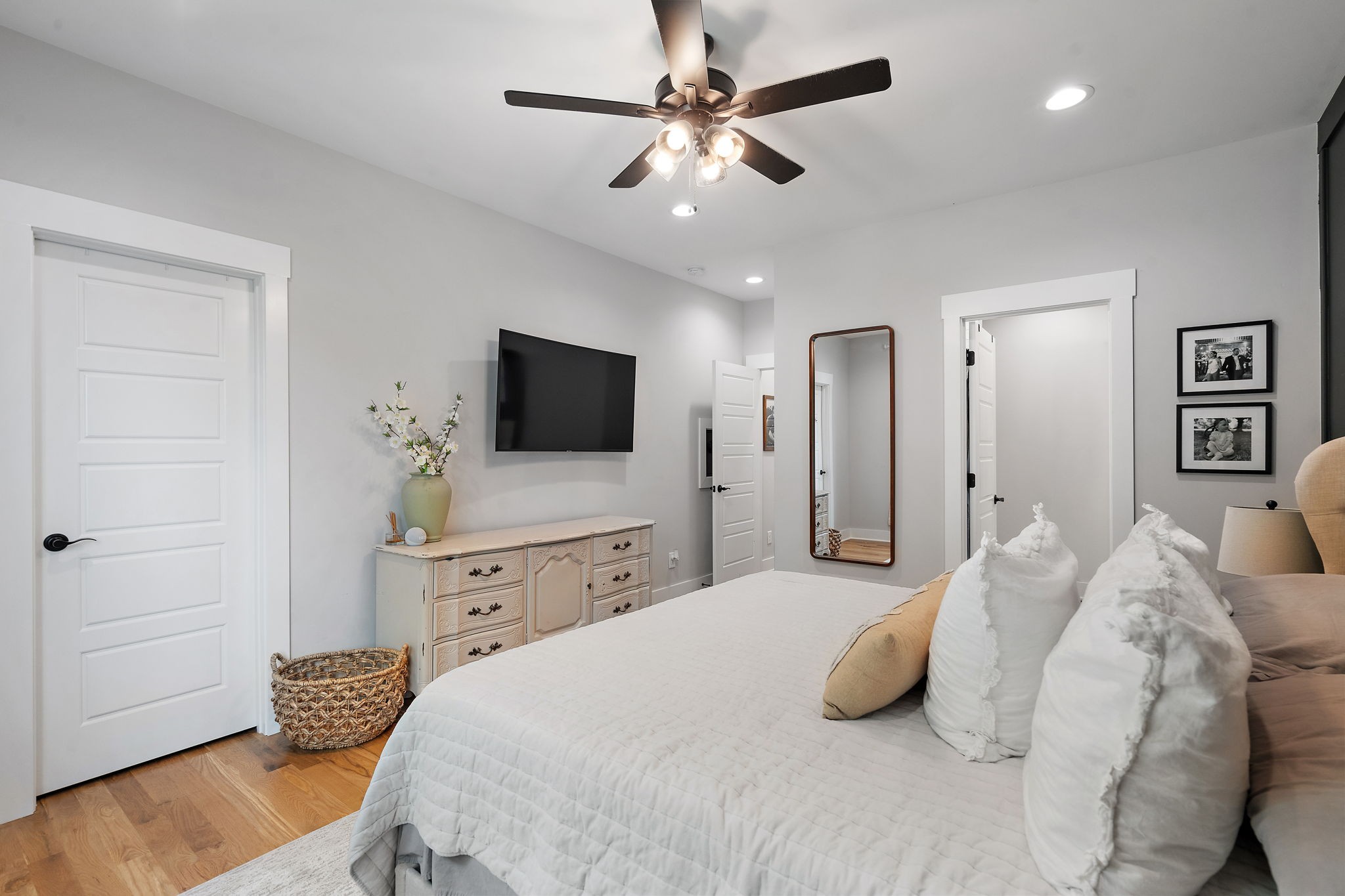 167 South Garner Street Springfield, TN 37172 - Photo 26 of 37 a bedroom with a bed a chandelier and a flat screen tv