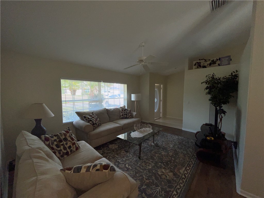 962 Montrose Avenue Sebastian, FL 32958 - Photo 3 of 30 a living room with furniture and a potted plant