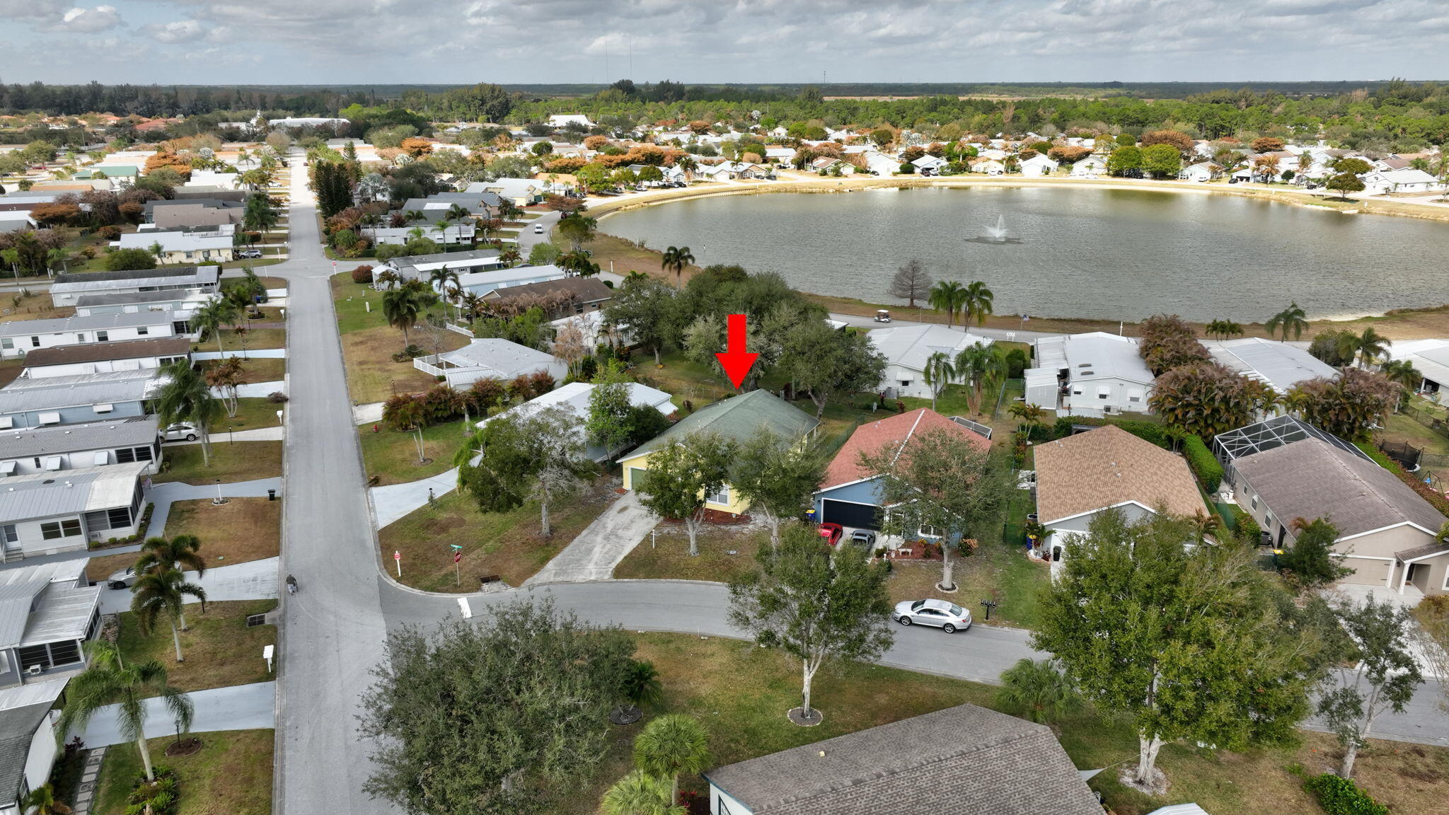 9042 Southwest Caprice Circle Stuart, FL 34997 - Photo 11 of 13 9042-21 Aerial with Lake
