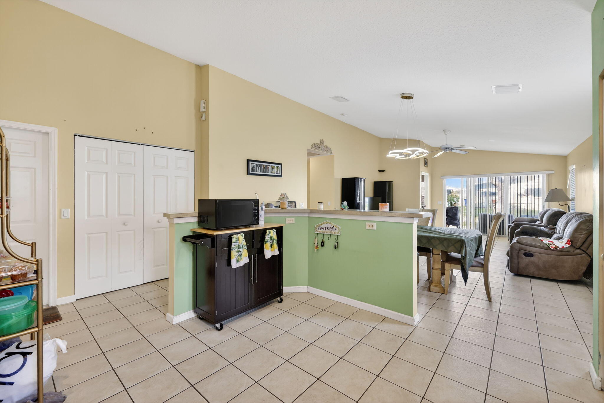 9042 Southwest Caprice Circle Stuart, FL 34997 - Photo 4 of 13 9042-04 Great Room from Kitchen