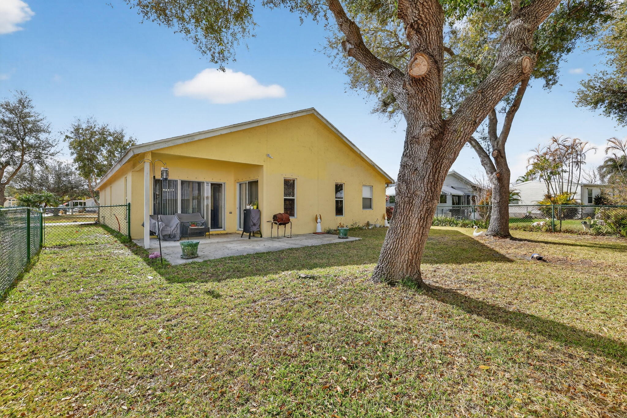 9042 Southwest Caprice Circle Stuart, FL 34997 - Photo 9 of 13 9042-23 Backyard 2