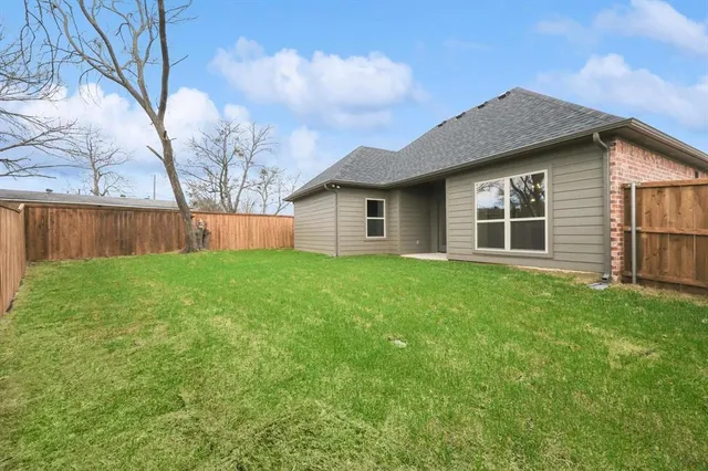 a house view with swimming pool in front of it