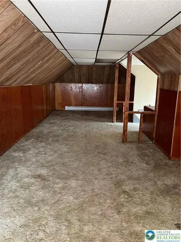 a view of a hallway with a room