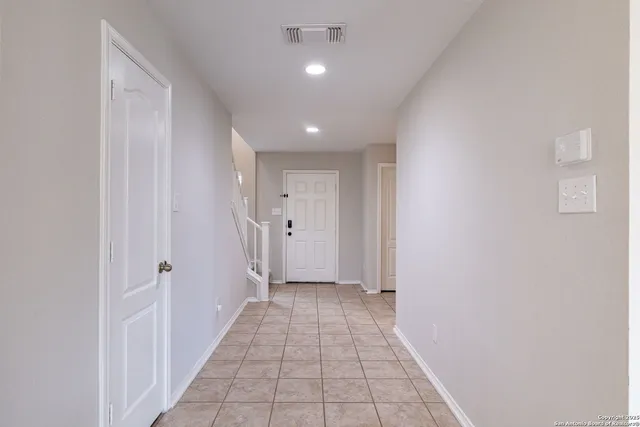 a view of a hallway with a white walls