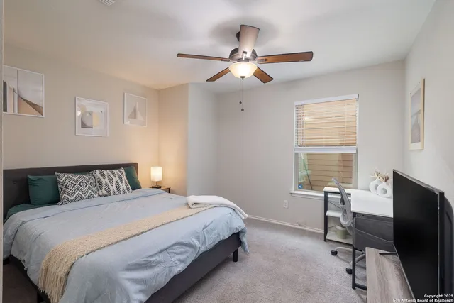 a bedroom with a bed and a table