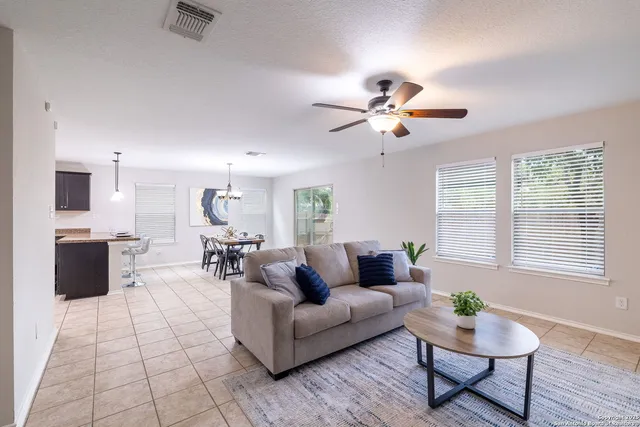 a living room with furniture and a large window