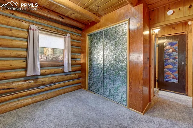 a bathroom with a granite countertop sink a toilet and mirror