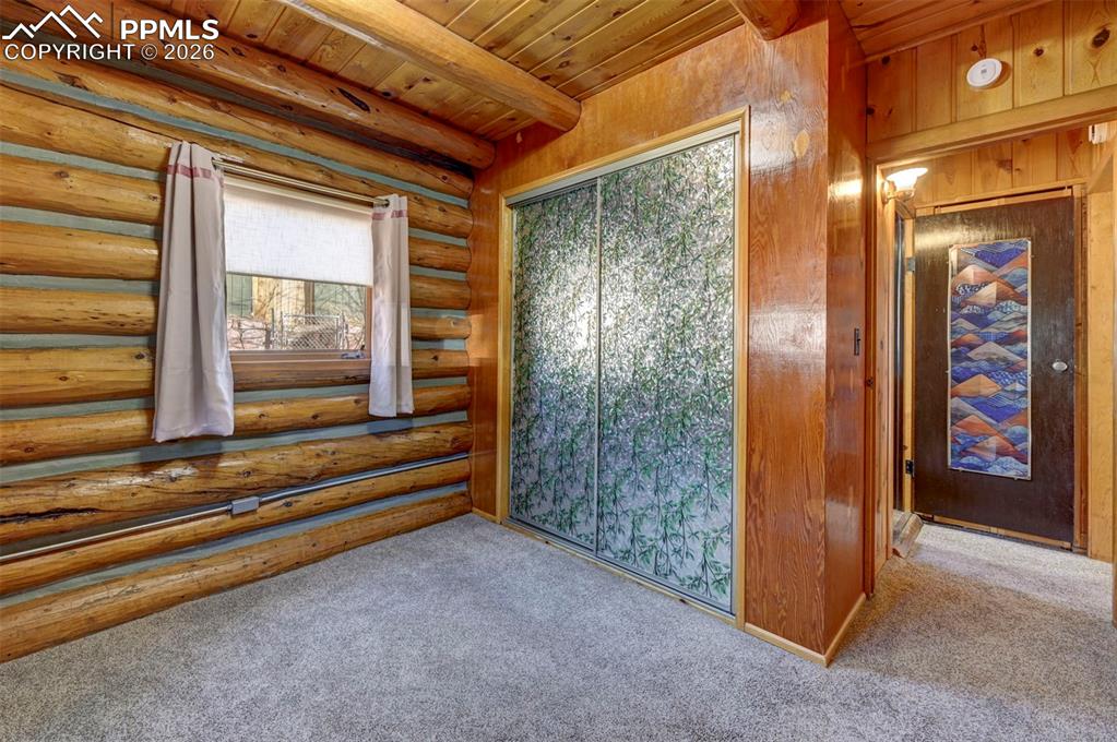 7915 Topeka Avenue Cascade, CO 80809 - Photo 21 of 36 a view of a entryway door of the house