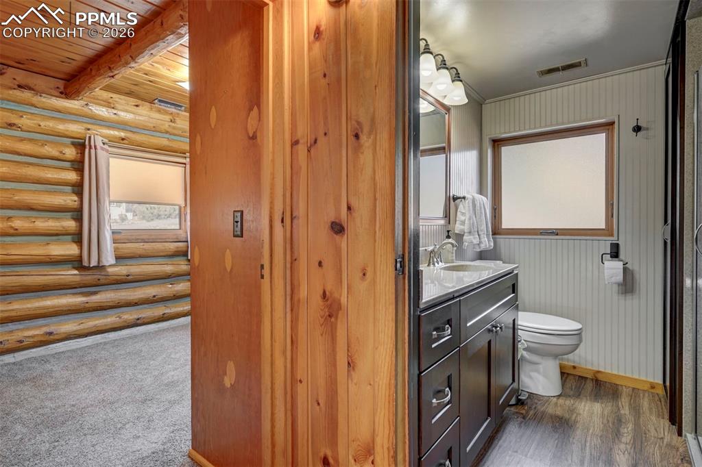 7915 Topeka Avenue Cascade, CO 80809 - Photo 25 of 36 a bathroom with a granite countertop sink toilet and shower