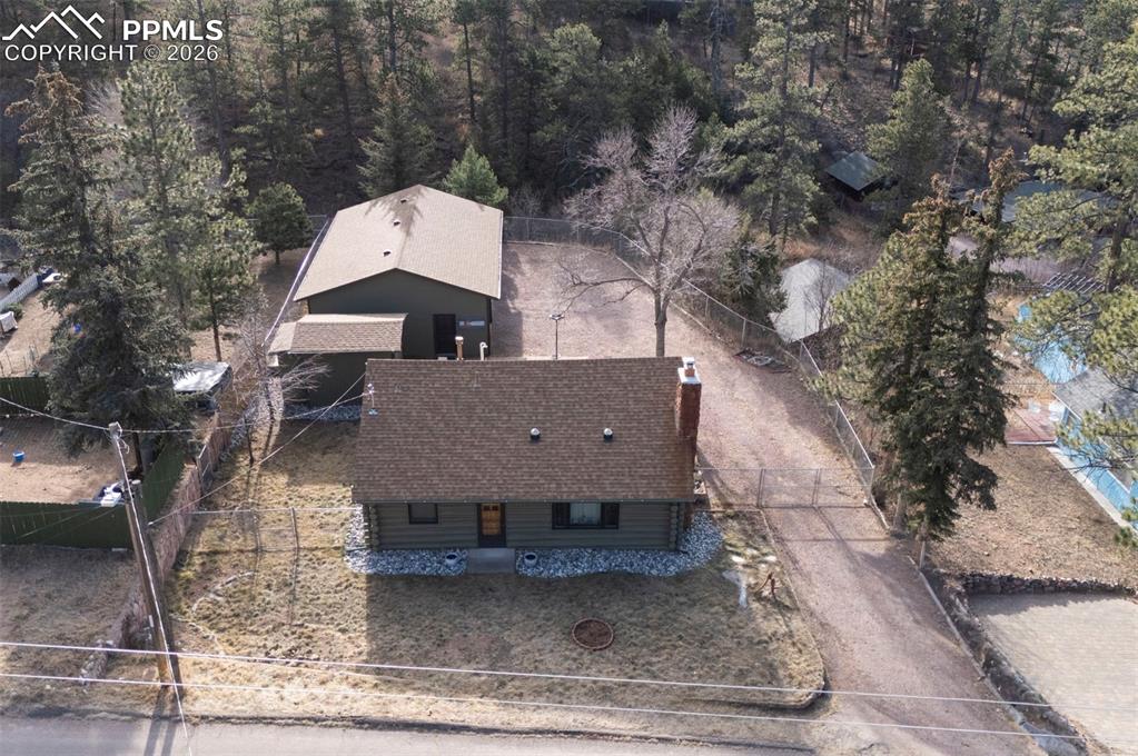 7915 Topeka Avenue Cascade, CO 80809 - Photo 32 of 36 an aerial view of a house with a yard