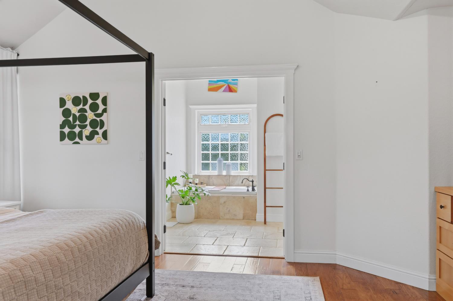 10120 Shenandoah Road Plymouth, CA 95669 - Photo 63 of 86 a bedroom with a bed and a painting on the wall