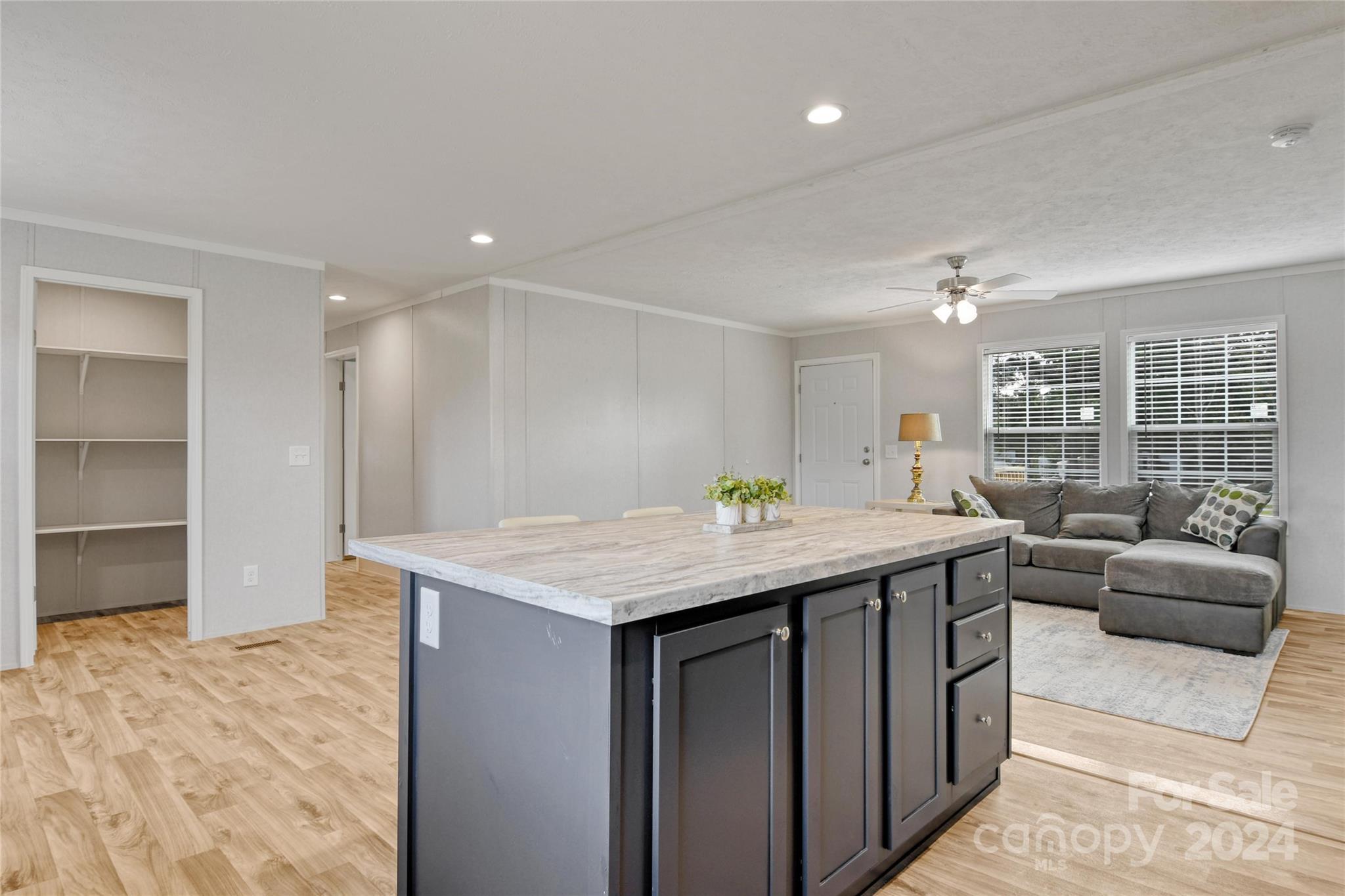 129 Calhoun Road Stony Point, NC 28678 - Photo 8 of 22 a view of kitchen with furniture and wooden floor