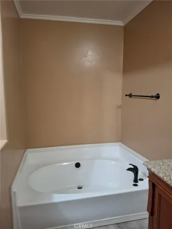 a bathroom with a granite countertop sink double and mirror